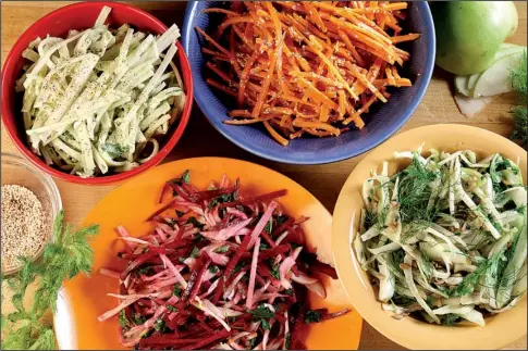  ?? Chicago Tribune/ TNS/ MICHAEL TERCHA ?? Cabbageles­s slaws include ( from top left) Kohlrabi Slaw With Creamy Herb and Avocado Dressing; Carrot Slaw With Miso Vinaigrett­e; Shaved Fennel with Arugula Crunch Salad; and Raw Beet Slaw With Fennel, Tart Apple and Parsley.