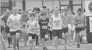  ?? Builtwell Bank ?? Racers took off early on March 16 to run the GradURun, an annual race conducted by Builtwell Bank of Ringgold to raise money for Catoosa Communitie­s in Schools.