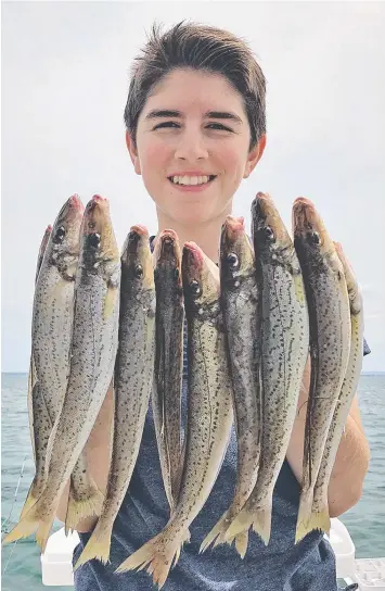  ??  ?? Angus Illingwort­h with the whiting he and his mum Janet caught in Corio Bay’s outer harbour.