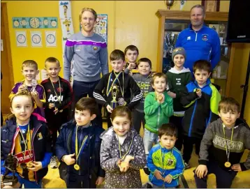  ??  ?? Geraldine O’Hanrahans’ under-7 and under-9s with Diarmuid O’Keeffe and trainer Ger Feeney at the club’s Coiste na nÓg awards. Photos: Mary Browne