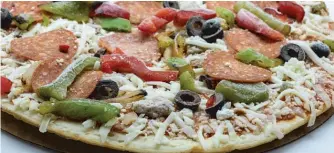 ?? STOCK.ADOBE.COM ?? Frozen pizzas tend to be full of salt, sugar and fat, but now scientists are trying to understand if there’s something else about such processed foods that might be bad for us.