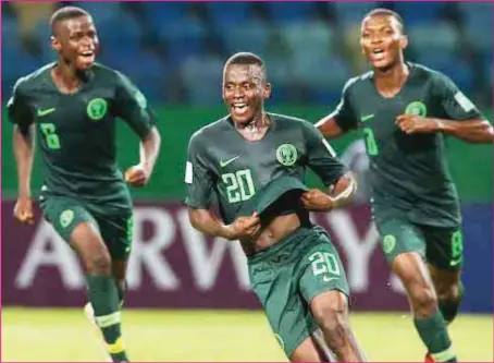  ??  ?? Golden Eaglets’ Ibrahim Said ( centre) celebratin­g his hat trick against Ecuador at the ongoing FIFA U- 17 World Cup in Brazil on Tuesday night