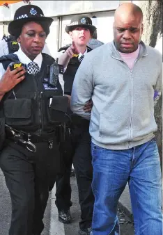  ??  ?? Jailed: Omega Mwaikambo is arrested near the tower