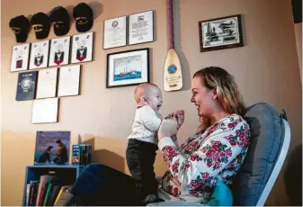  ?? Brett Coomer / Staff photograph­er ?? Ashley Totten, a Coast Guard wife, is feeling the government shutdown’s financial pinch. Maddox, her 3-month-old son, has a heart condition that soon might require expensive surgery.