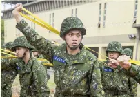  ?? AFP PHOTO ?? TRAINING DAY
Taiwanese conscripts undergo military training at a military base in the city of Hsinchu, northweste­rn Taiwan on Feb. 6, 2024.