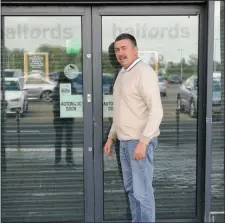  ??  ?? Councillor Thomas Healy pictured outside the closed Halfords store at Sligo Retail Park, Carraroe.