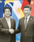  ?? GETTY ?? Japanese prime minister Shinzo Abe (left) and Chinese president Xi Jinping