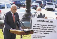  ?? Anna Moneymaker / New York Times ?? Sen. Chuck Schumer stands next to a poster quoting the words of Sen. Mitch McConnell in 2016.
