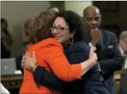  ??  ?? Assemblywo­men Cristina Garcia, right, and Eloise Reyes celebrate victory for the supplement­al bill Garcia sponsored.