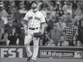  ?? CHARLES KRUPA/AP PHOTO ?? Boston relief pitcher Craig Kimbrel reacts after giving up an RBI single to Houston’s Carlos Beltran during the ninth inning in Game 4 of an American League Division Series on Monday at Fenway Park. Houston won, 5-4, to win the series.