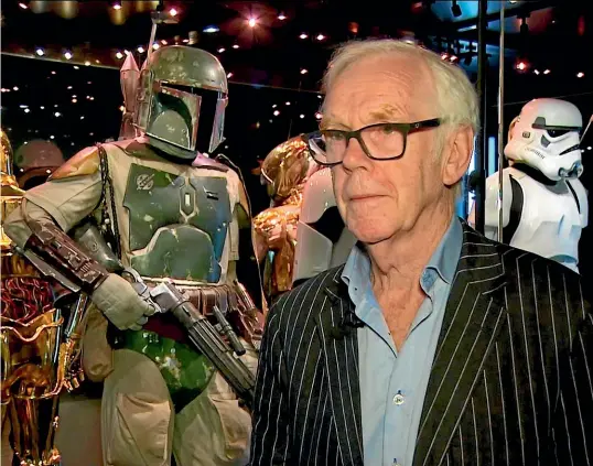  ?? AP ?? Jeremy Bulloch in front of the costume he wore while playing Boba Fett in The Empire Strikes Back and Return of the Jedi.