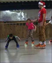  ?? ?? Local families having fun at a previous Elf Event Holiday Party at Northside Hansen Arena.