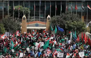  ?? AP/BILAL HUSSEIN ?? Palestinia­ns rally Tuesday in front of the United Nations headquarte­rs in Beirut. The group was protesting a U.S.-sponsored economic aid plan that is the focus of a two-day workshop in Bahrain.