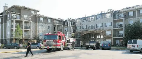  ?? LARRY WONG/EDMONTON JOURNAL ?? A fire early Monday destroyed 20 units in a west-end condominiu­m building at 1520 Hammond Gate.