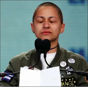  ?? AP/ALEX BRANDON ?? Emma Gonzalez, a student at Marjory Stoneman Douglas High School, leads the crowd Saturday in Washington in a tearful silence after reciting the names of those killed at her school.