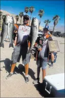  ?? Photo by Bryan Simons ?? Henderson’s Bryan Simons, with the help of his 12-year-old son Kyle, shows his catch at River-rama 2017.