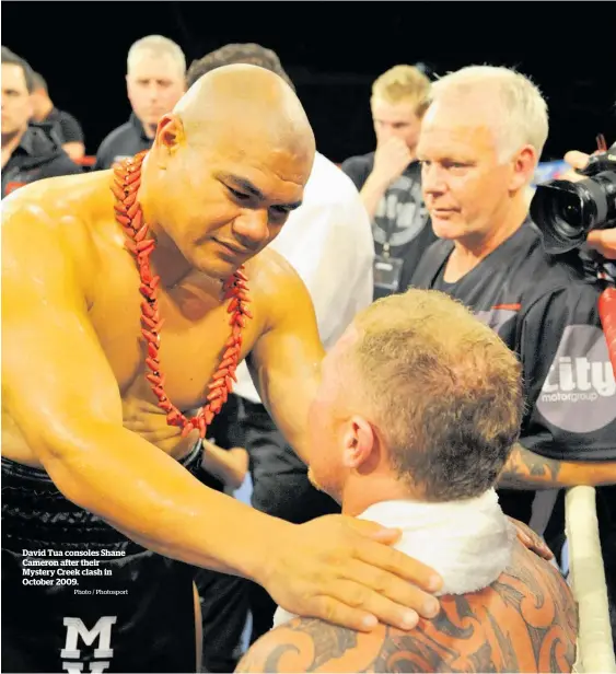  ?? Photo / Photosport ?? David Tua consoles Shane Cameron after their Mystery Creek clash in October 2009.