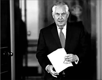  ?? WIN MCNAMEE/GETTY ?? Secretary of State Rex Tillerson denies resignatio­n reports during a statement Wednesday at the State Department.