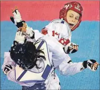  ??  ?? CP PHOTO Canada’s Evelyn Gonda (right) competes against Mexico’s Pauline Armeria during the women’s 57-kilogram semifinal taekwondo match at the Pan Am Games in Mississaug­a, Ont., Monday.