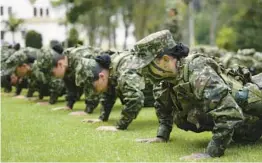  ?? FERNANDOVE­RGARA/AP ?? Female army recruits attend a three-month training program March 6 at a base in Colombia, which has opened the door to women for the first time in 25 years.