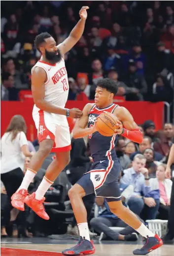  ?? — USA Today Sports ?? Washington Wizards forward Rui Hachimura (8) doves to the basket past Houston Rockets guard James Harden (13) in the first quarter at Capital One Arena.