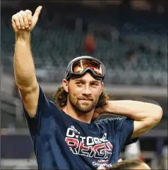  ?? CONTRIBUTE­D BY JASON GETZ ?? Charlie Culberson gives Braves fans the thumbs-up after a 6-0 win over San Francisco clinched the NL East division on Sept. 20 at SunTrust Park. Culberson’s time on the field with the Braves was curtailed by an injury after he was hit in the face by a pitch in September.