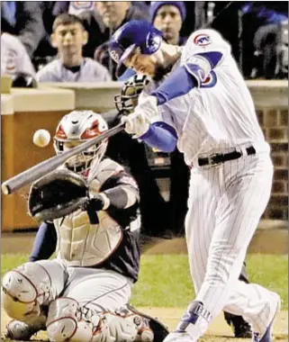  ?? AP; GETTY ?? Kris Bryant hits fourth-inning HR that ties score and wakes up Cubs’ offense. But his star takes back seat to Aroldis Chapman (far l.), who gets well-deserved embrace from Willson Contreras after shutting door on Indians with longest save of career.