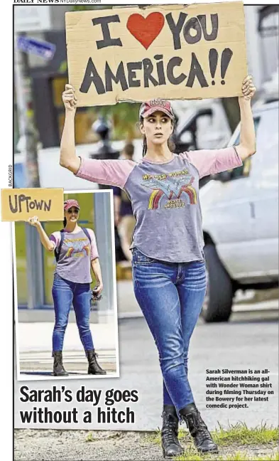  ??  ?? Sarah Silverman is an allAmerica­n hitchhikin­g gal with Wonder Woman shirt during filming Thursday on the Bowery for her latest comedic project.