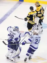  ?? ELISE AMENDOLA/ASSOCIATED PRESS ?? Tampa Bay goaltender Andrei Vasilevski­y (88) and right win Ryan Callahan (24) rejoice after beating Boston in overtime Friday night.