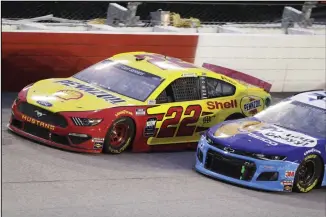  ??  ?? Joey Logano (22) leads Ty Dillon (13) during the NASCAR Cup Series auto race Wednesday, May 20, 2020, in
Darlington, South Carolina. (AP)