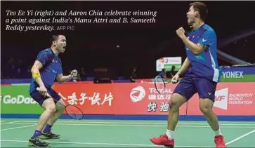  ?? AFP PIC ?? Teo Ee Yi (right) and Aaron Chia celebrate winning a point against India’s Manu Attri and B. Sumeeth Reddy yesterday.