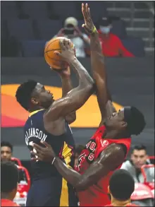  ?? AP PHOTO/CHRIS O’MEARA ?? New Orleans Pelicans forward Zion Williamson (1) shoots over Toronto Raptors forward Pascal Siakam (43) during the first half of an NBA basketball game Wednesday in Tampa, Fla.