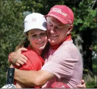  ?? NWA Democrat-Gazette/DAVID GOTTSCHALK ?? Magnolia sophomore Meghan Lindsey (left) gets a hug from Coach Marvin Lindsey on Tuesday after shooting a 73 to win the Class 4A state girls golf tournament at Big Sugar Golf Course in Pea Ridge.