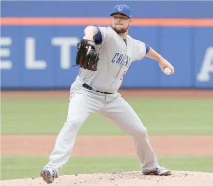  ?? AP ?? Cubs starter Jon Lester allowed two hits, struck out seven and walked three in seven innings Sunday against the Mets.