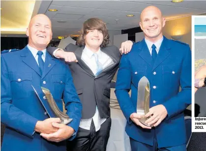  ?? Photo / Mark Mitchell ?? Senior Constable Bryan Farquharso­n (left) and Constable Paul Bailey with Joshua McQuoid, who they rescued in Napier in 2013.