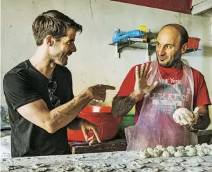  ??  ?? John Gregory-smith (left) cooks with Zachariah, a local baker in the Beqaa Valley Below