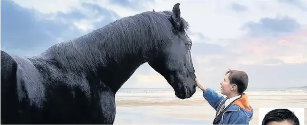  ??  ?? Jorgen Bangsund, 11, of Aberdare is in a new Lloyds Bank advert alongside the iconic black stallion