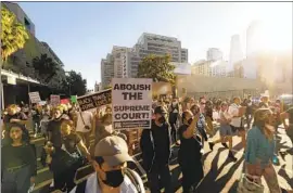  ?? Genaro Molina Los Angeles Times ?? PROTESTERS march in downtown Los Angeles on Friday after the Supreme Court overturned Roe vs. Wade, ending constituti­onal protection­s for abortion.