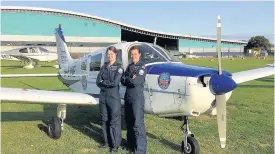  ??  ?? Chocks away Rachel, left, with co- pilot Claire Birch