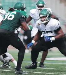  ?? MICHELLE BER ?? Terran Vaughn, right, is the likeliest candidate to start at left offensive tackle for the Saskatchew­an Roughrider­s.