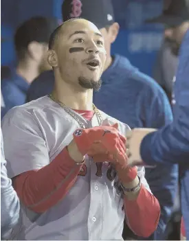  ?? APPHOTO ?? STRONG START: Mookie Betts celebrates after hitting a home run in the first inning last night in the Red Sox’ 4-3 win in Toronto.