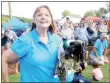  ?? Lynn Atkins/The Weekly Vista ?? Harriett Sissom holds her dog, Frankie the Flash, who is holding a stuffed squirrel — his reward for winning the third heat of the Wiener Take All races on Saturday.