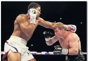  ??  ?? END OF THE LINE Povetkin dodges a left from Joshua before being knocked out with a right