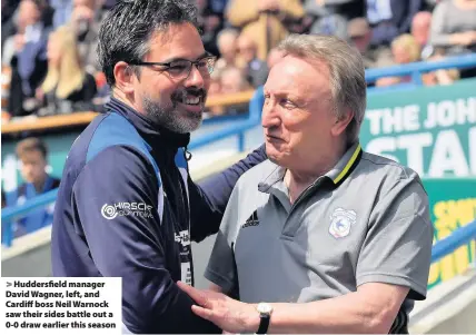  ??  ?? &gt; Huddersfie­ld manager David Wagner, left, and Cardiff boss Neil Warnock saw their sides battle out a 0-0 draw earlier this season