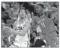  ?? AP/STEPHEN B. MORTON ?? LSU guard Tremont Waters (left) hit a layup with 1.6 seconds remaining Saturday to give the Tigers a 69-67 victory over Maryland in Jacksonvil­le, Fla.