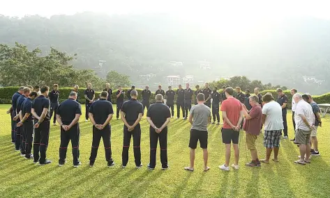  ??  ?? The England cricket squad and members of the media observe a two-minute silence to mark Armistice Day in Kandy yesterdayS­TU FORSTER/GETTY IMAGES