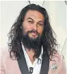  ?? Aquaman ?? Jason Momoa's scrunchie added a touch of whimsy to the actor’s look.