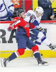  ?? DIRK SHADD/THE ASSOCIATED PRESS ?? The Capitals’ Jakub Vrana checks the Tampa Bay Lightning’s Ondrej Palat during Game 6 on Monday.