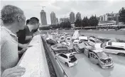  ?? STR/AFP TNS ?? Heavy rains hit Zhengzhou in China’s central Henan province, causing a gridlock of cars in the floodwater­s.