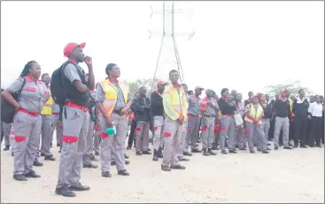  ?? Photo: Emmency Nuukala ?? Demanding decent salaries… Security guards gather for duty in an open area in Windhoek.